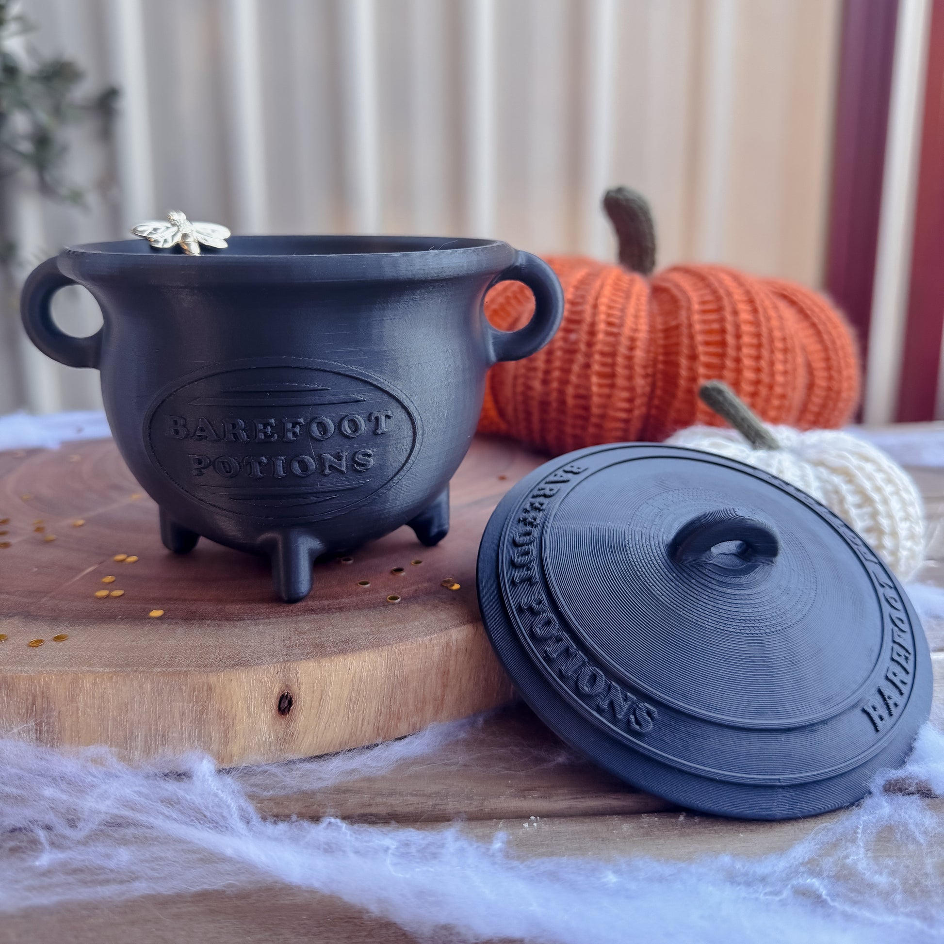 Black cauldron & lid with 'barefoot Potions' text on. 
3D Printed product. Halloween. 
$49.95 
light weight cauldron