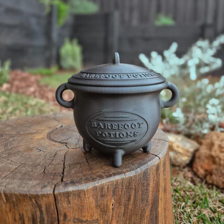 Black cauldron & lid with 'barefoot Potions' text on. 
3D Printed product. Halloween. 
for sale $49.95 
light weight cauldron
sensory play
potion play