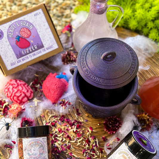 Spooky-themed items including a jar, bottle, and decorative elements on a wooden surface.